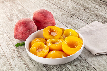 Sweet ripe yellow canned peaches