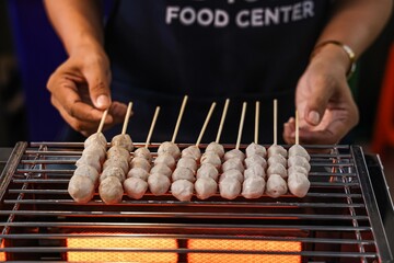 Grilled Meatballs on Skewers at a Food Stall.