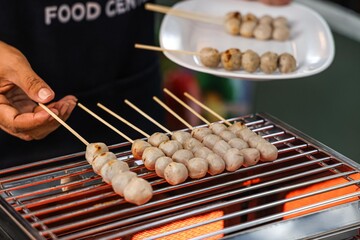 Grilled Meatballs on Skewers at a Food Stall.
