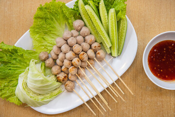 Grilled Meatballs with Vegetables and Spicy Sauce.
