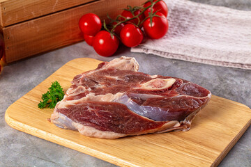 Raw lamb steak with bone