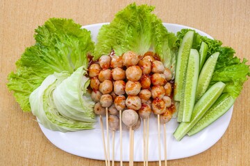 Grilled Meatballs with Spicy Sauce and Fresh Vegetables.