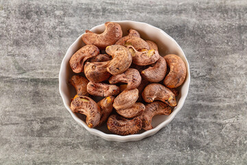 Unpeeled cashew nuts in the bowl