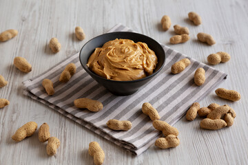 Organic Creamy Peanut Butter in a Bowl, side view.