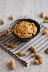 Organic Creamy Peanut Butter in a Bowl, side view.