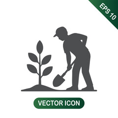 Planting a Tree Person with Shovel in Action, Planting Sapling