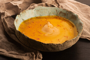 Traditional Polish Sour Rye Soup with Saffron in Ceramic Bowl
