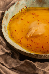 Traditional Polish Sour Rye Soup with Saffron in Ceramic Bowl