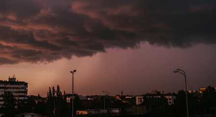 Dark Storm Clouds Over Urban Neighborhood During Sunset