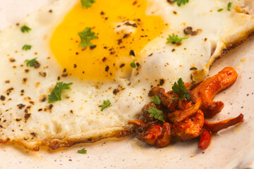 Fried Cordyceps Mushrooms with Sunny Side Up Egg on Handmade Ceramic Plate