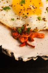 Fried Cordyceps Mushrooms with Sunny Side Up Egg on Handmade Ceramic Plate