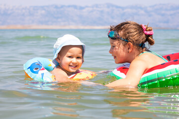 Children enjoying a sunny day in the water