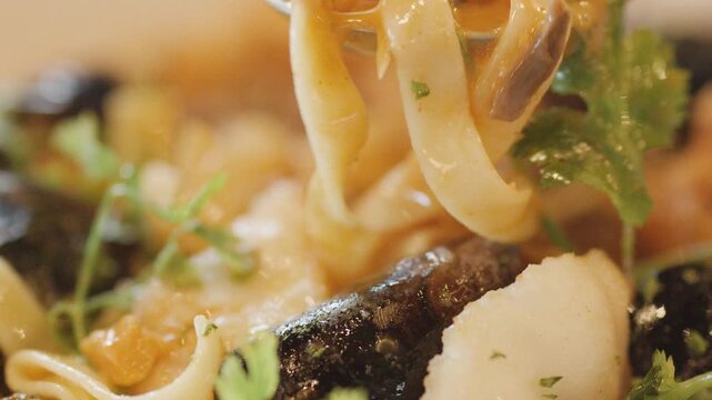 Close-Up of Steaming Seafood Chowder With Spoon and Herbs