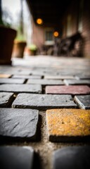 Close-up of a patterned brick walkway, with muted colors and a shallow depth of field