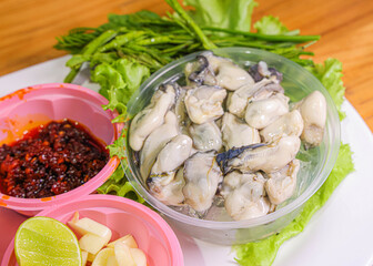 Fresh Oysters with Chili Sauce, Garlic, and Lime