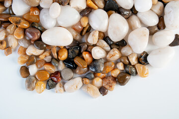 A variety of small stones of different geological origins on white background.