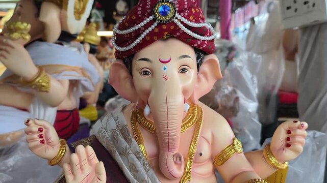 Newly made idols of the God known as Ganesha or Ganapati for sale at a shop on the eve of Ganesh festival in Pune, India.