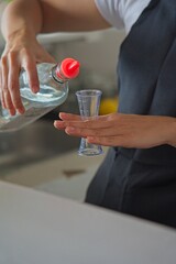 Bartender Pouring a Measured Amount of Liquid
