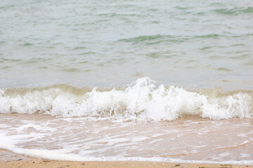Gentle waves at a sandy beach
