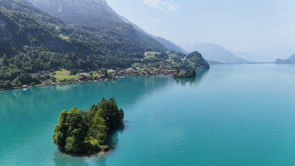 Obraz premium Small island Iselwalt village Switzerland Lake Brienz drone,aerial