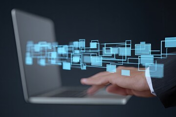 Hands interacting with digital interface elements on a laptop