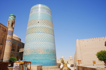 Kalta-minor Minaret and Walled Fortress known as Itchan Kala in Khiva, Uzbekistan -...