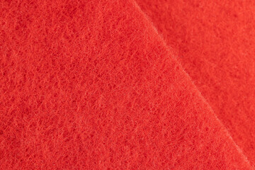 red cloth for washing dirt on objects, glued and tightly intertwined synthetic threads of red color on the sponge that is used for cleaning and washing