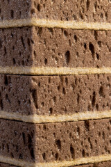 sponge for washing dirty dishes or other objects, a synthetic sponge with lots of holes for good foaming of detergents and is used for cleaning