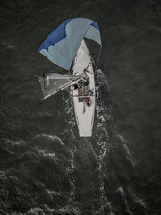 Drone aerial view of a sailing yacht on the English channel