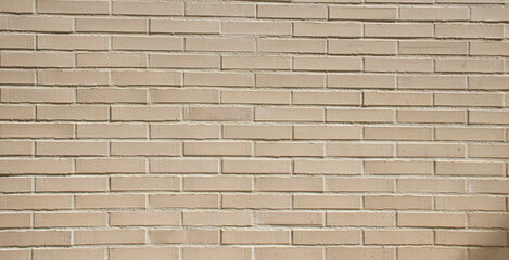 Small brick wall background, beige brick texture and masonry pattern, ideal for construction, architecture, and decorative design projects. this building wall with clean brick surface.
