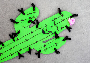 Green cactus with a pink flower on top craft