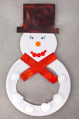 Snowman with a red scarf and a black hat crafts