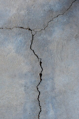 Close-up of cracked and rough concrete for overlay background.