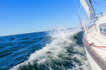 Luxury sailing yacht under genoa and mainsail cutting through waves of the Baltic Sea, Gulf of...