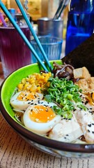 A colorful bowl of ramen topped with soft-boiled eggs, corn, green onions, tofu, mushrooms, and sesame seeds