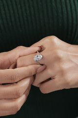 Elegant silver engagement ring with a large round-cut diamond, beautifully displayed on a woman’s...
