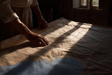 man gazes intently at ancient map of tuscany filled with excitement for his upcoming adventure