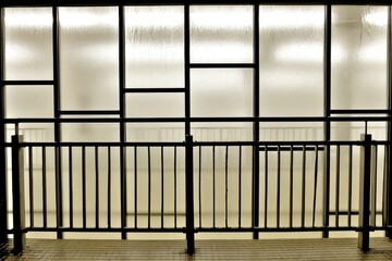 Modern metal railing, frosted glass panels