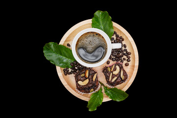 Hot black coffee cup and coffee beans,leaf on  wooden tray with black background.