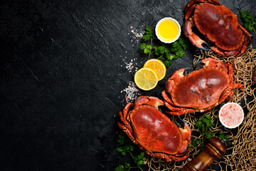 Delicious boiled large crabs with claws, served with lemon, salt and spices. A great appetizer with...