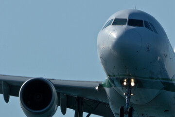 Close-Up of Passenger Jet Nose and Cockpit Windows. Airplane in the blue sky, close-up of the plane