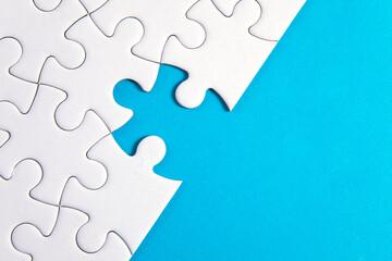 Puzzle pieces on blue background
