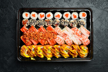 Set of sushi and maki on stone table. Top view with copy space