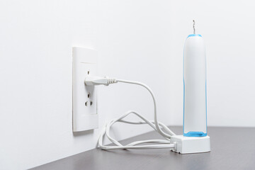 Outer case of electric toothbrush on the charger