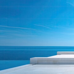 Coastal infinity pool, white steps, clear sky