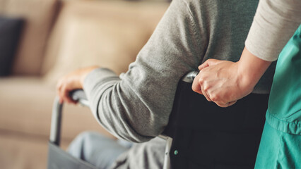 Healthcare worker with elderly patient in wheelchair