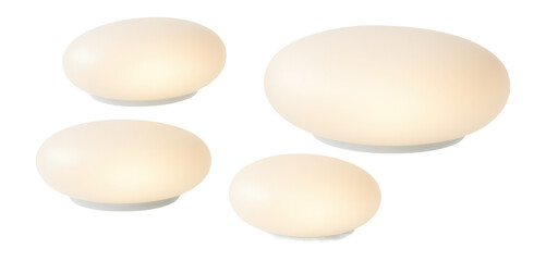 Flat, pebble-shaped glowing stones for decorating an apartment balcony, enhancing the space with a subtle, warm light.