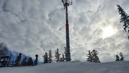 Transmitter on the slope under cloudy sky