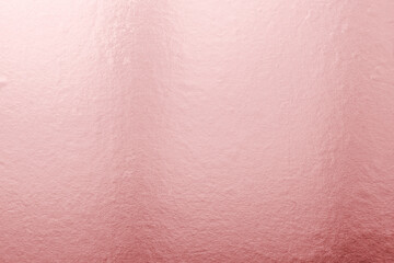 Rose gold pink background foil leaf metallic texture wrapping paper for shiny glowing wallpaper design decoration, reflective luminous gradient backdrop