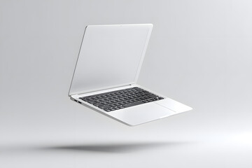 Open silver laptop isolated on white background, perfect for technology, business, and modern work concepts.
